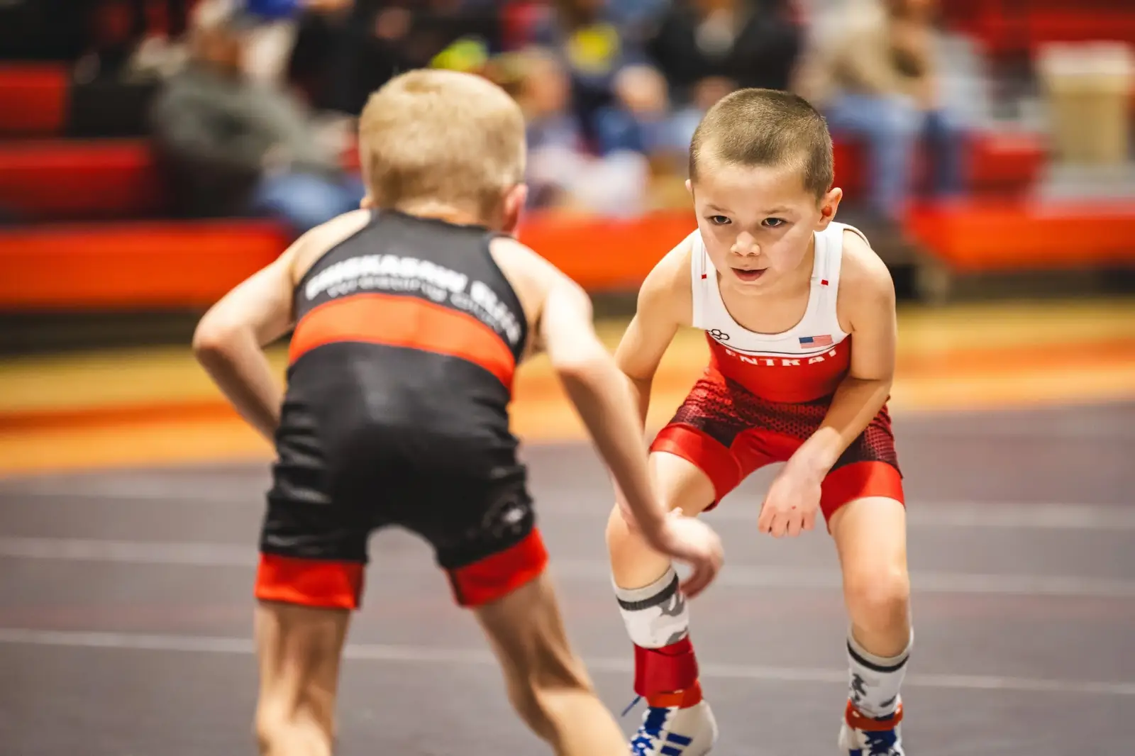 Two young wrestlers squared up at a weekend tournament